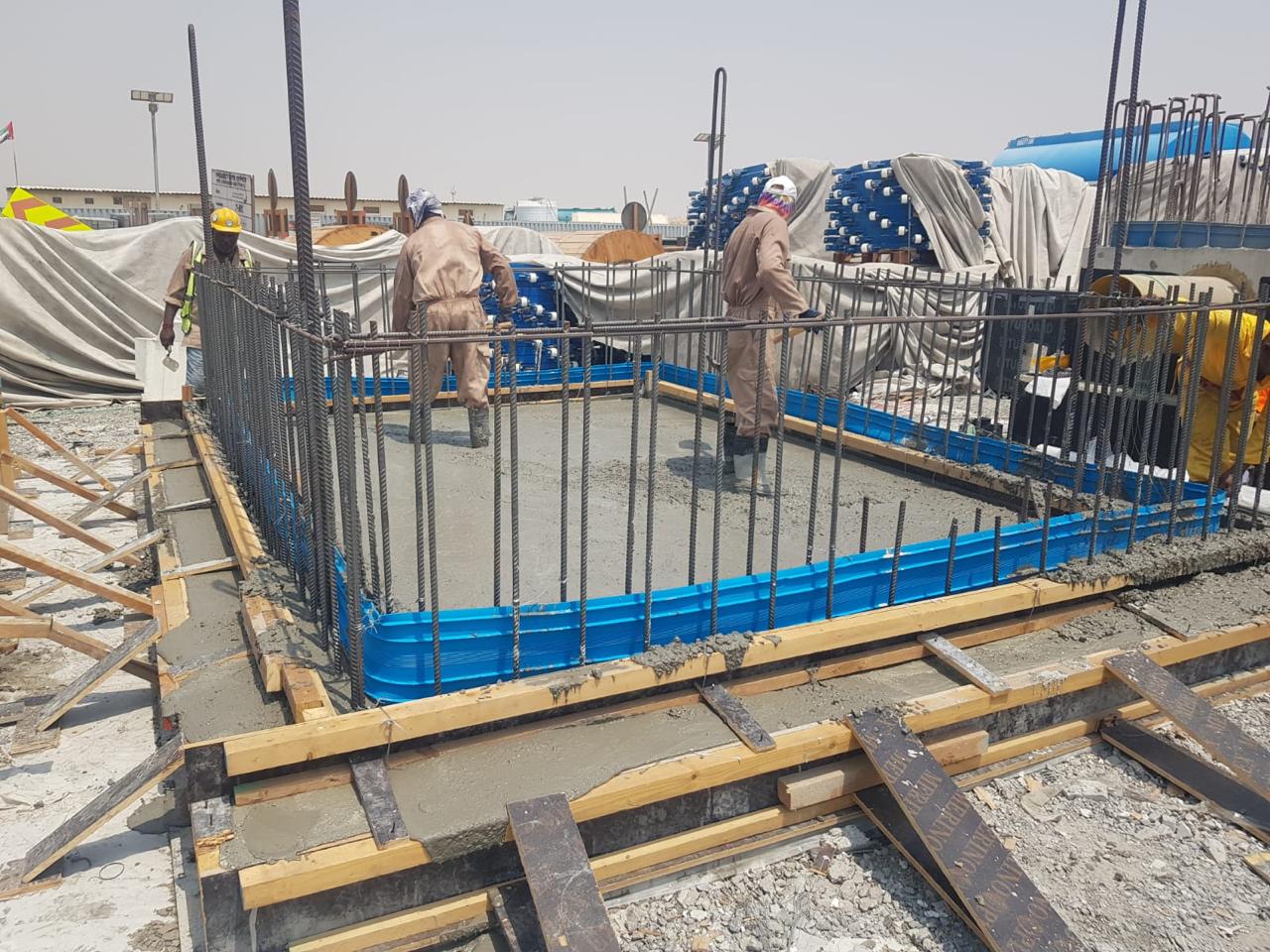 Finished steel assembly staged on pallets for transport in a warehouse environment